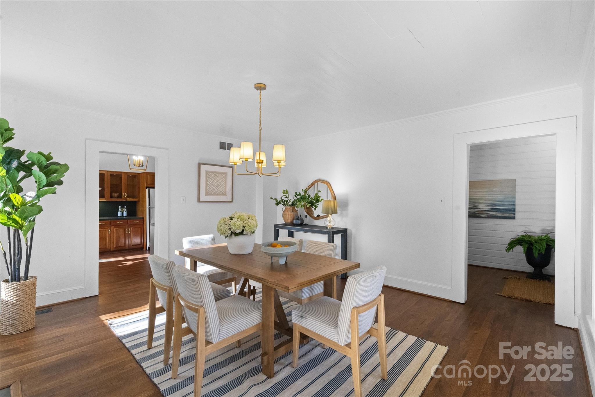 5607 Matthews-Mint Hill Road Charlotte, NC 28227 - Photo 13 of 45 a view of a dining room with furniture and wooden floor