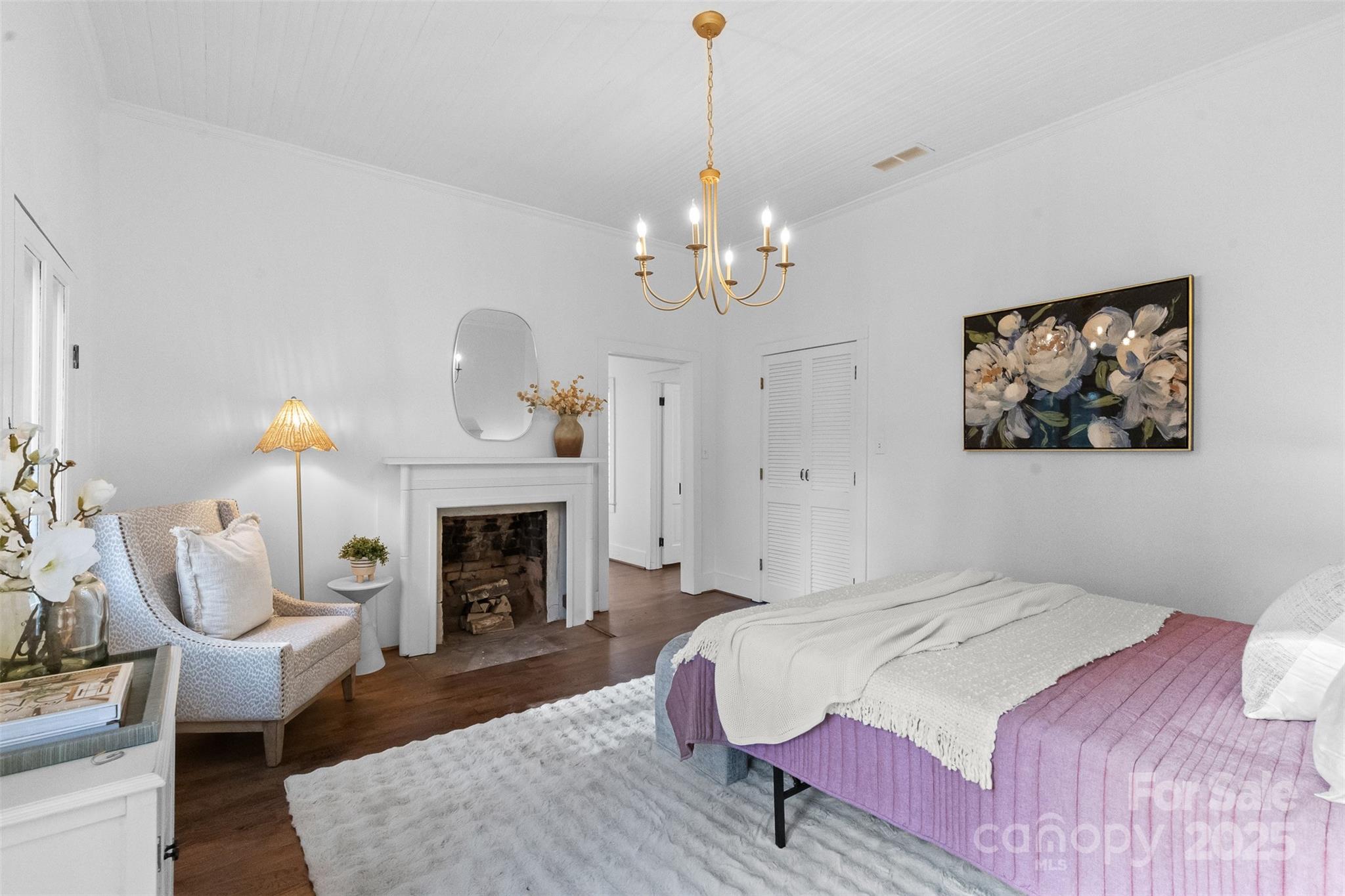 5607 Matthews-Mint Hill Road Charlotte, NC 28227 - Photo 24 of 45 a bedroom with bed and a fireplace