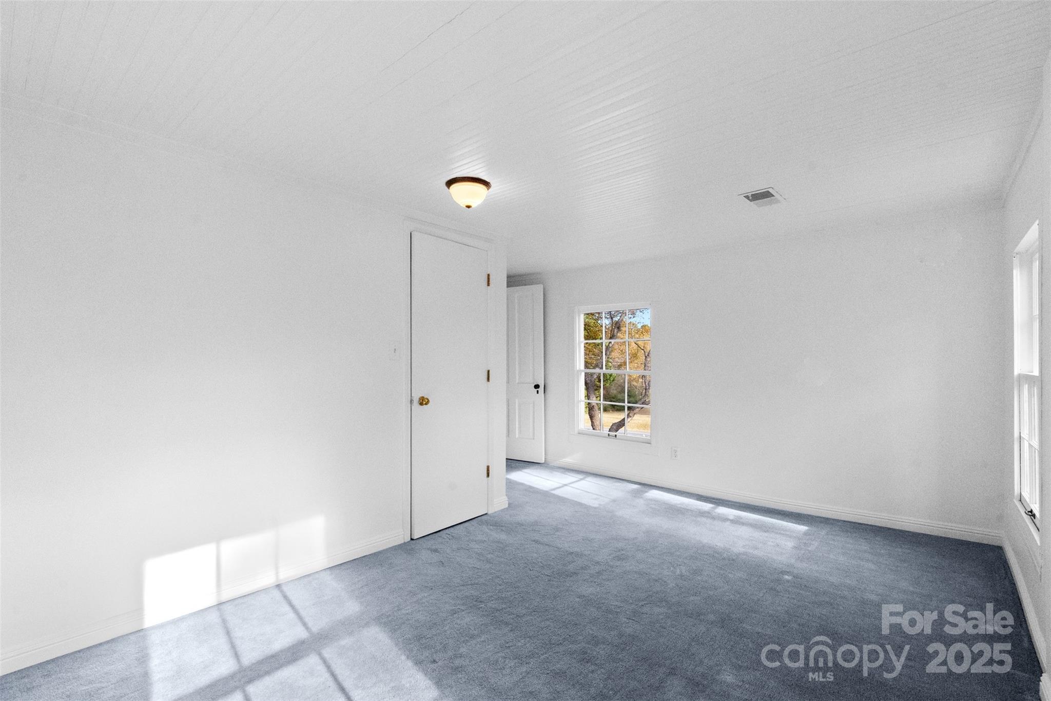 5607 Matthews-Mint Hill Road Charlotte, NC 28227 - Photo 32 of 45 a view of an empty room with a window