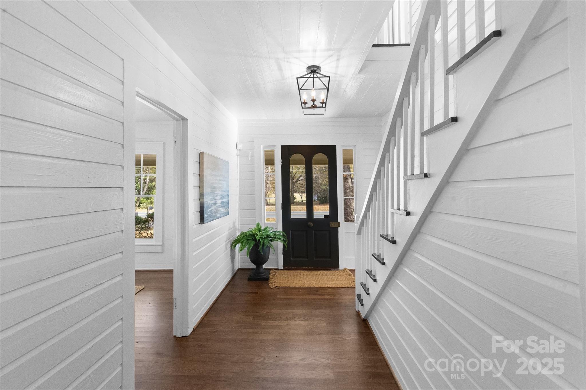 5607 Matthews-Mint Hill Road Charlotte, NC 28227 - Photo 4 of 45 a view of an entryway with wooden floor