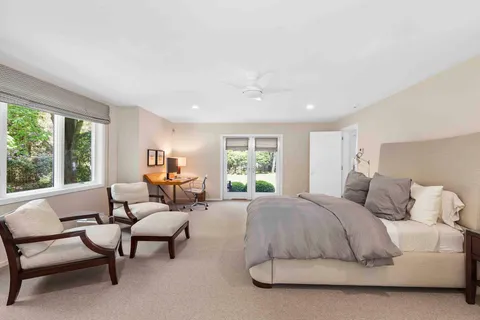 a bedroom with a bed and a couch