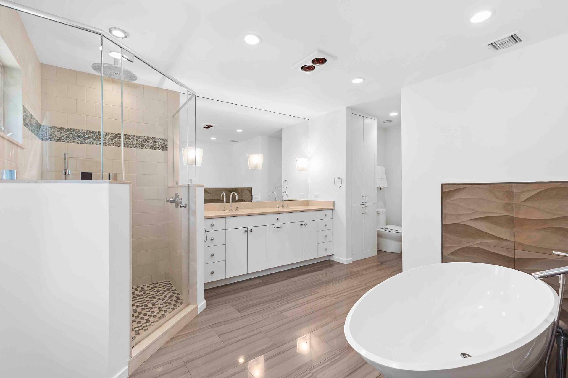 3 Acorn Path Quogue, NY 11959 - Photo 15 of 23 a bathroom with a double vanity sink a mirror and a shower