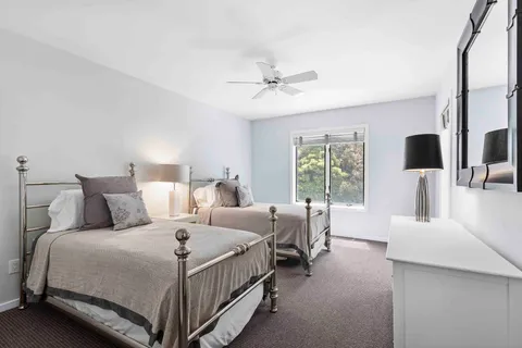 a bed room with bed and a flat tv screen