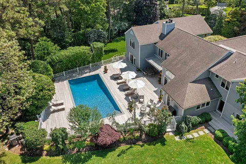 an aerial view of a house with a garden