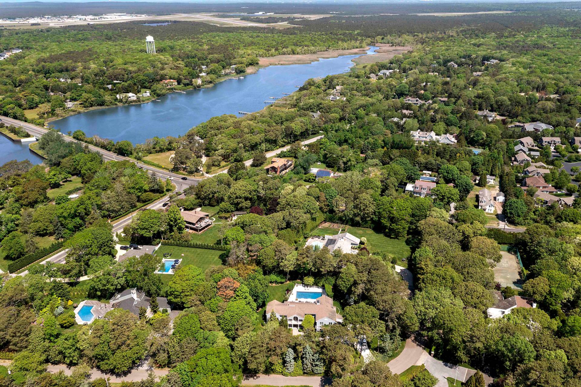 3 Acorn Path Quogue, NY 11959 - Photo 23 of 23 an aerial view of residential houses with outdoor space and trees