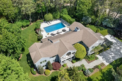 an aerial view of a house with a garden and plants