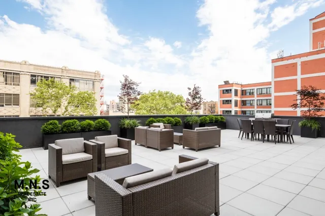 a view of a terrace with chairs and potted plants