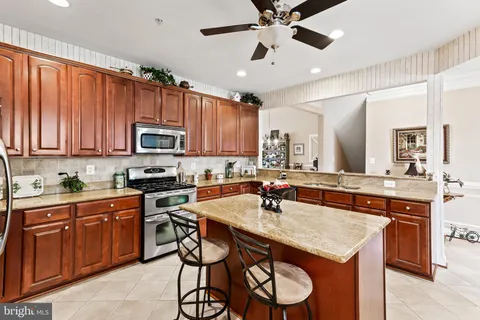 a kitchen with a sink appliances and cabinets