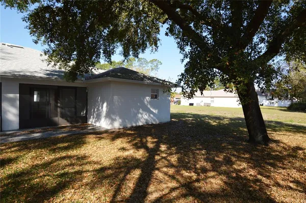a view of a barn in the middle of a yard