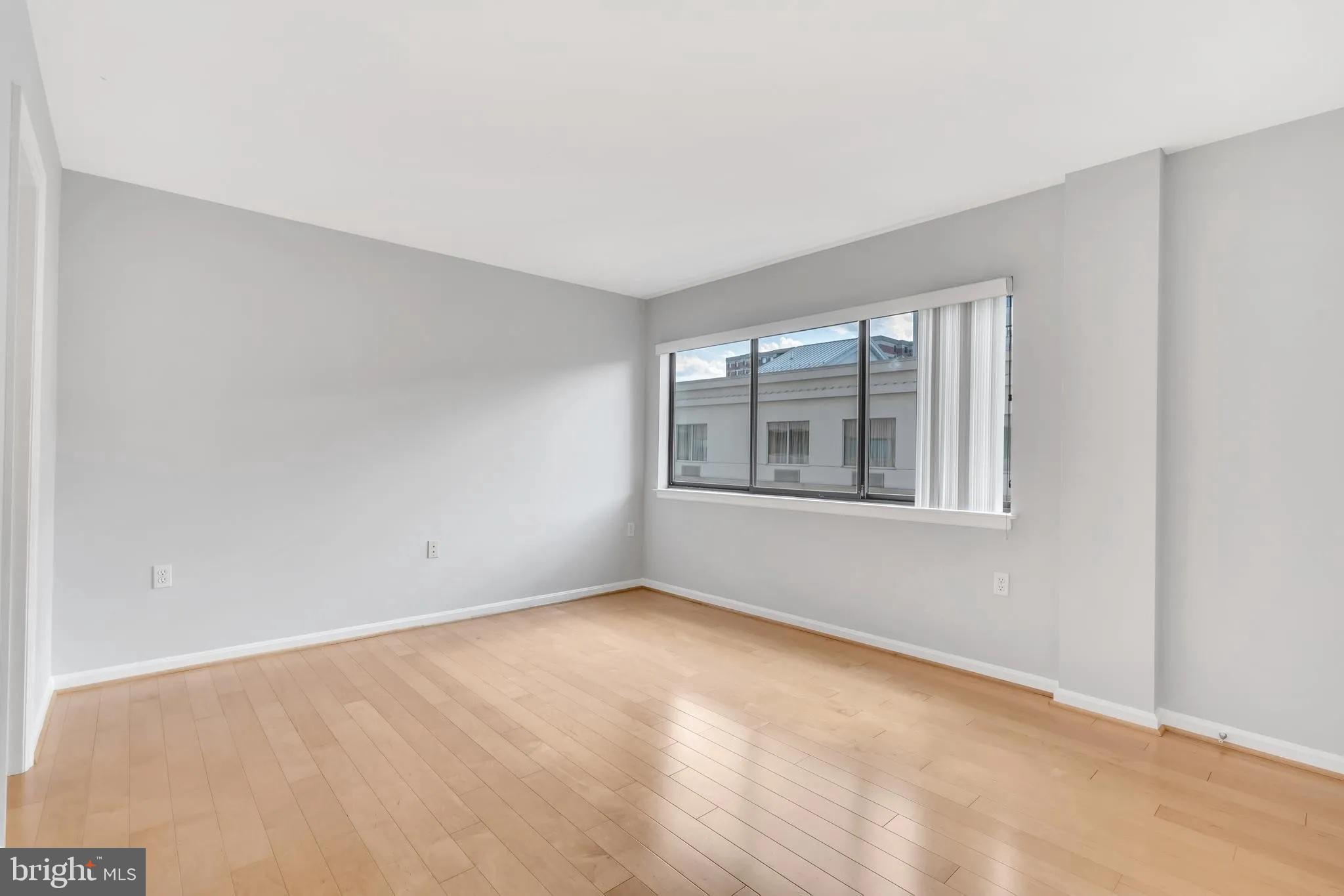 1301 North Courthouse Road, Unit 1007 Arlington, VA 22201 - Photo 17 of 41 a view of an empty room with a window