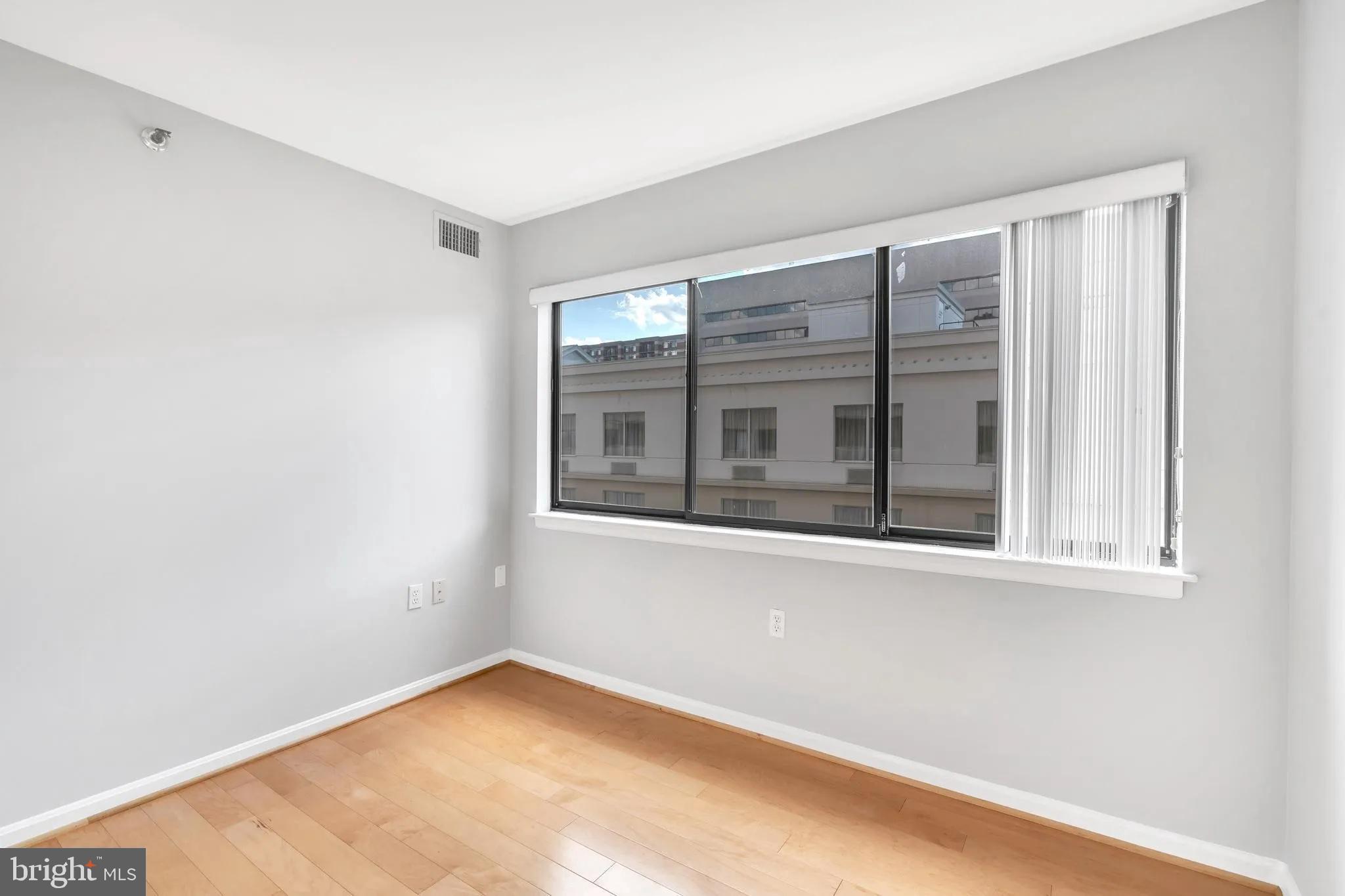 1301 North Courthouse Road, Unit 1007 Arlington, VA 22201 - Photo 19 of 41 a view of an empty room with a window
