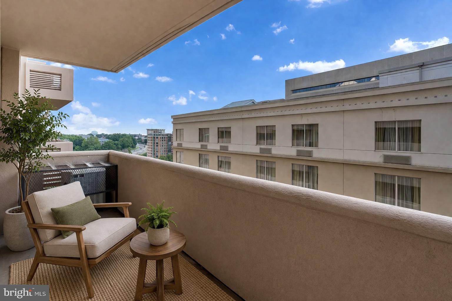 1301 North Courthouse Road, Unit 1007 Arlington, VA 22201 - Photo 2 of 41 a balcony with table and chairs