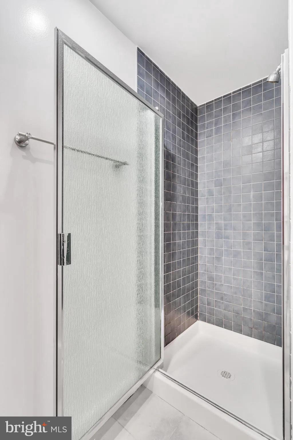 1301 North Courthouse Road, Unit 1007 Arlington, VA 22201 - Photo 21 of 41 a bathroom with a bathtub and a shower