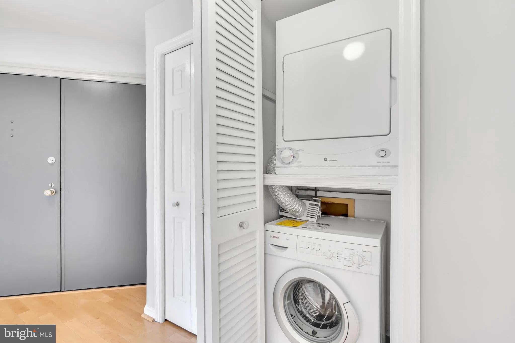1301 North Courthouse Road, Unit 1007 Arlington, VA 22201 - Photo 22 of 41 a utility room with dryer and washer
