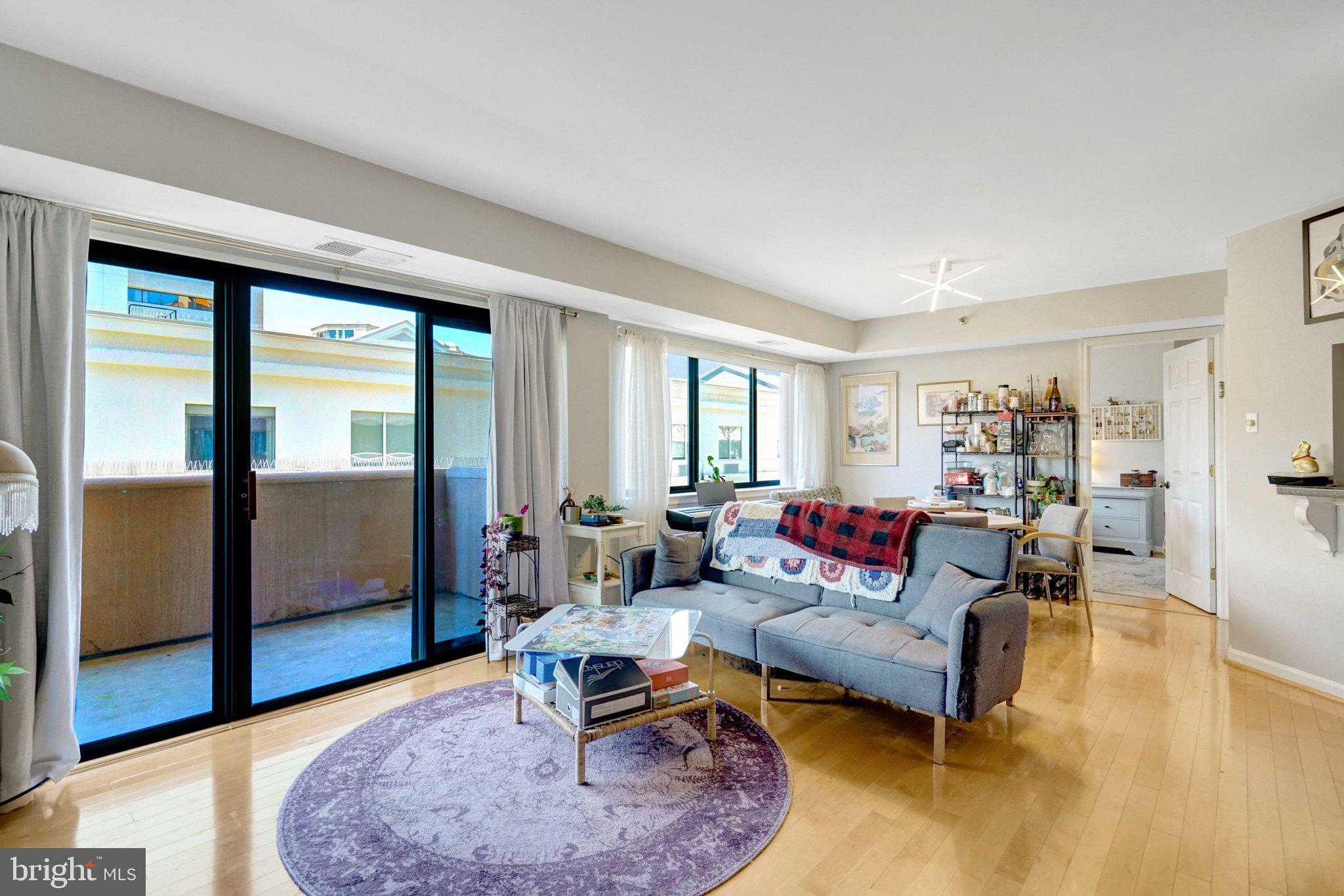 1301 North Courthouse Road, Unit 1007 Arlington, VA 22201 - Photo 25 of 41 a living room with furniture and a rug
