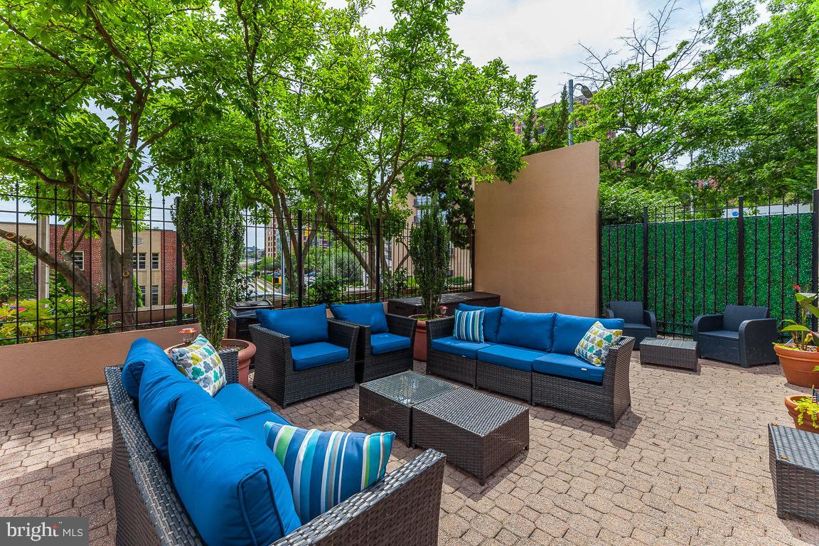 1301 North Courthouse Road, Unit 1007 Arlington, VA 22201 - Photo 32 of 41 a view of a patio with couches and a fire pit