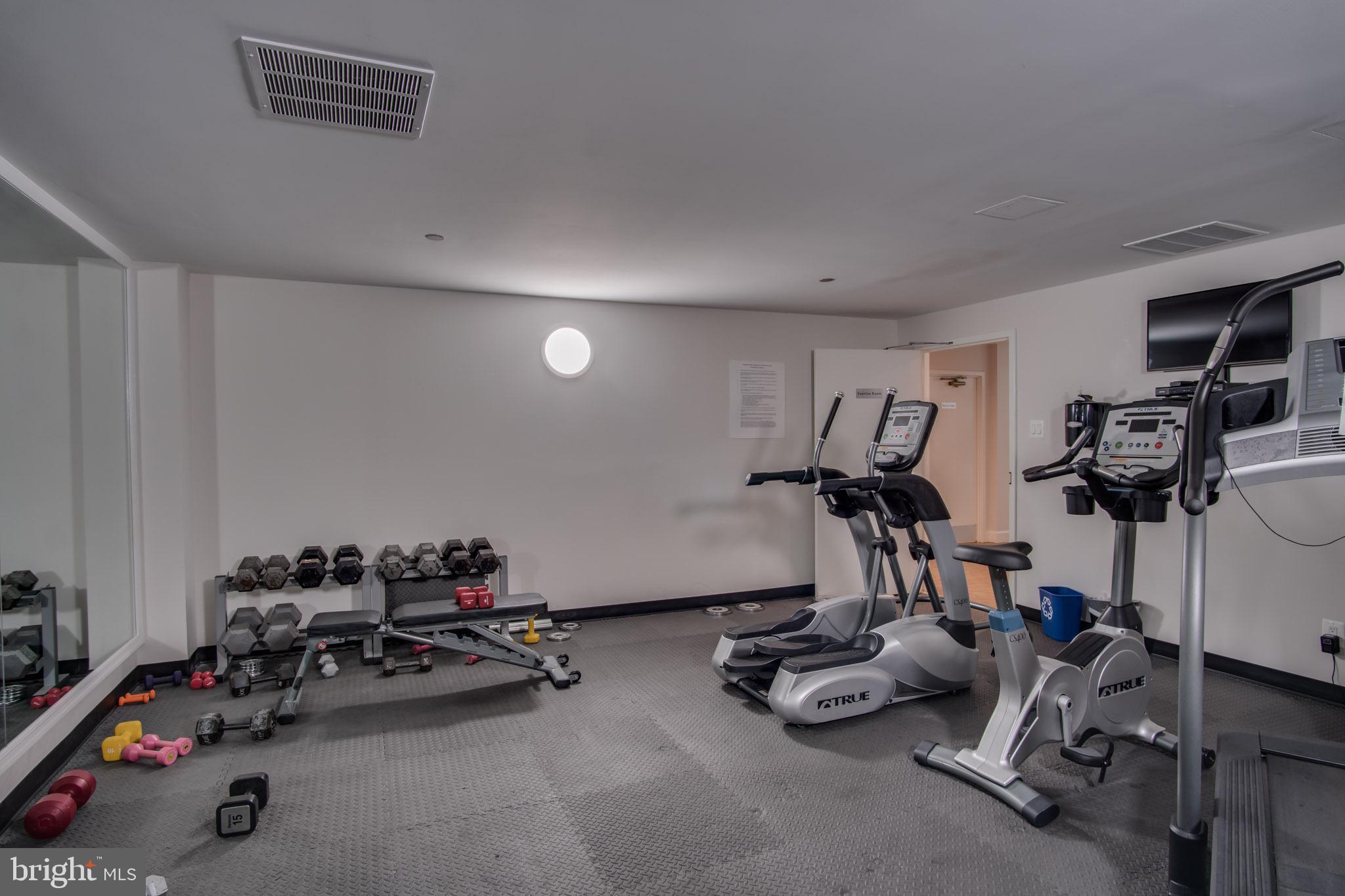 1301 North Courthouse Road, Unit 1007 Arlington, VA 22201 - Photo 37 of 41 a view of a room with gym equipment