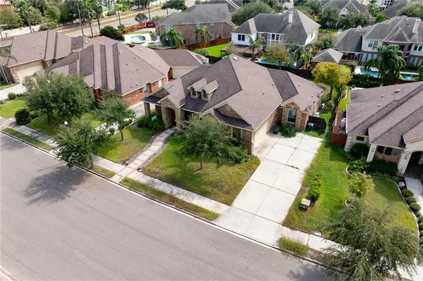 an aerial view of residential houses with outdoor space