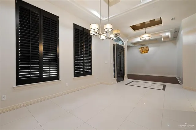 a view of an empty room with a fireplace