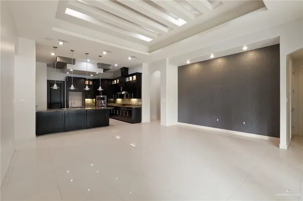 a view of a kitchen with a sink and cabinets