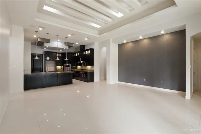a view of a kitchen with a sink and cabinets