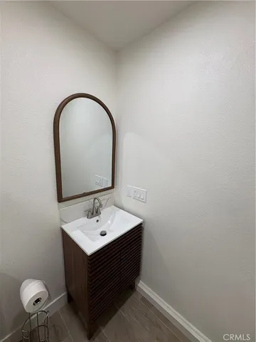 a room with a sink and a mirror