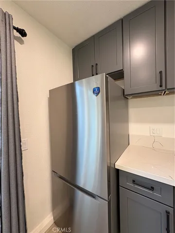 a white refrigerator freezer sitting in a kitchen