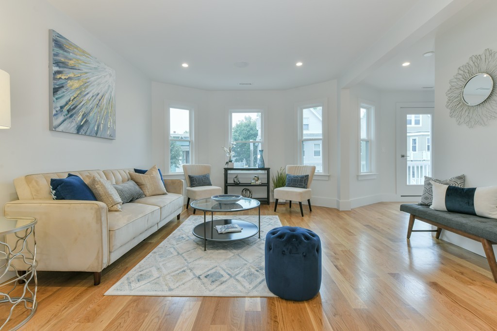 38 Edwin Street, Unit 2 Boston, MA 02124 - Photo 12 of 22 a living room with furniture and wooden floor
