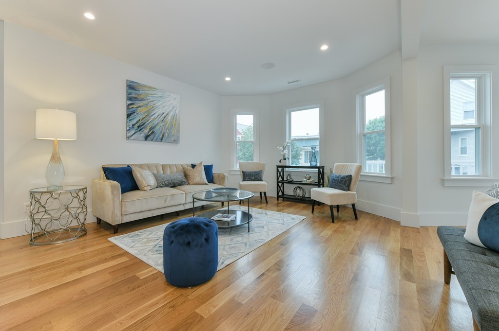 38 Edwin Street, Unit 2 Boston, MA 02124 - Photo 13 of 22 a living room with furniture and a wooden floor