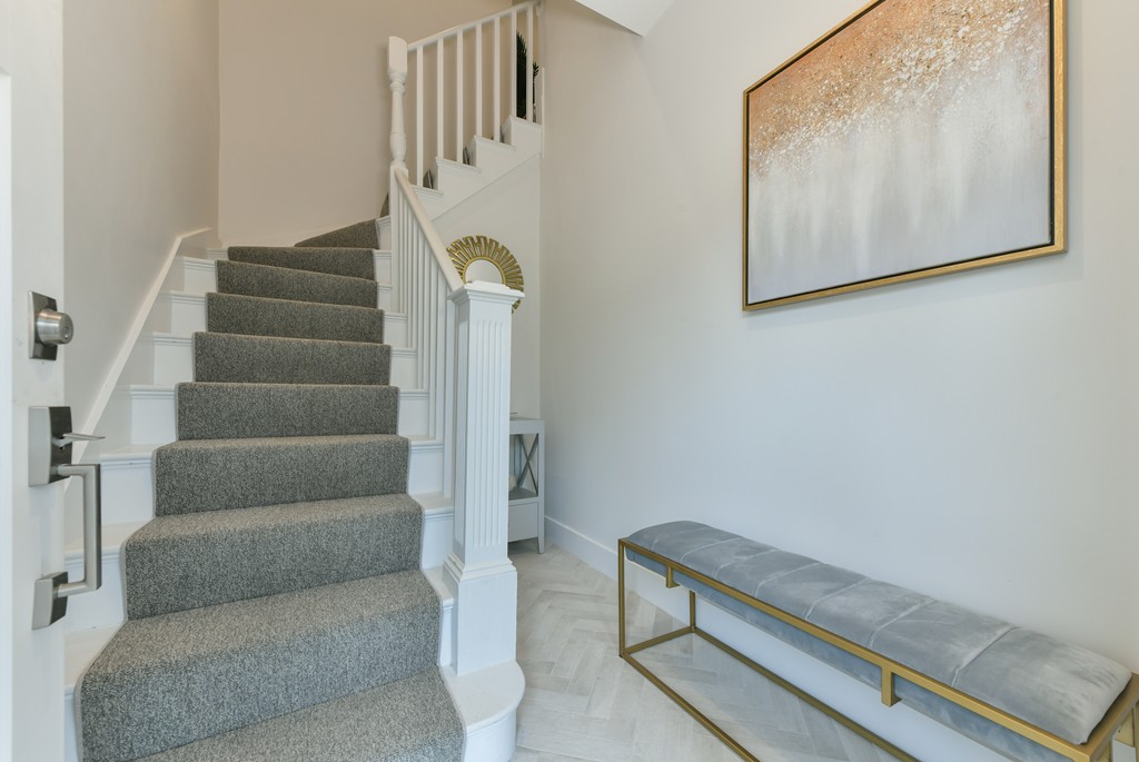 38 Edwin Street, Unit 2 Boston, MA 02124 - Photo 16 of 22 a view of staircase with rug and white walls