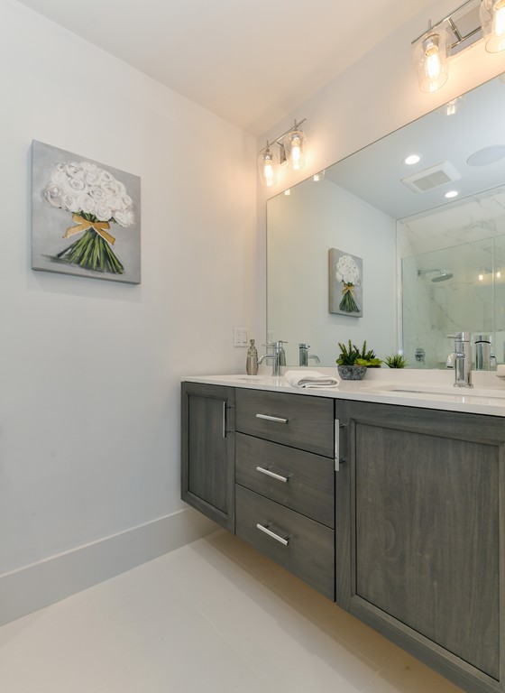 38 Edwin Street, Unit 2 Boston, MA 02124 - Photo 17 of 22 a bathroom with a sink mirror and vanity