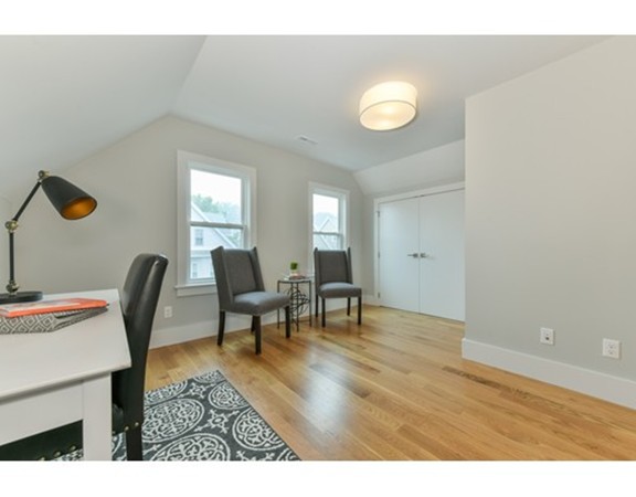 38 Edwin Street, Unit 2 Boston, MA 02124 - Photo 22 of 22 a view of a dining room with furniture and wooden floor
