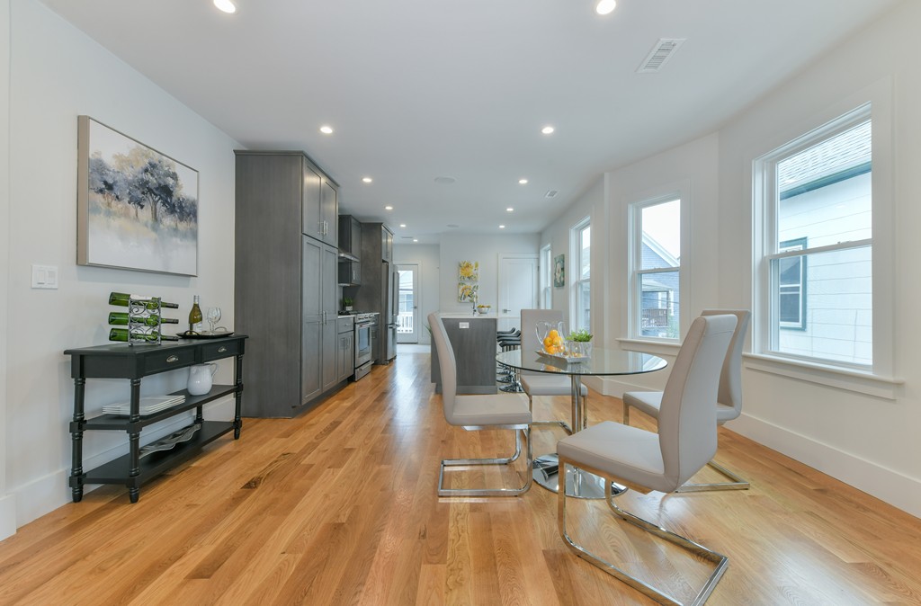 38 Edwin Street, Unit 2 Boston, MA 02124 - Photo 5 of 22 a view of a dining room with furniture window and wooden floor