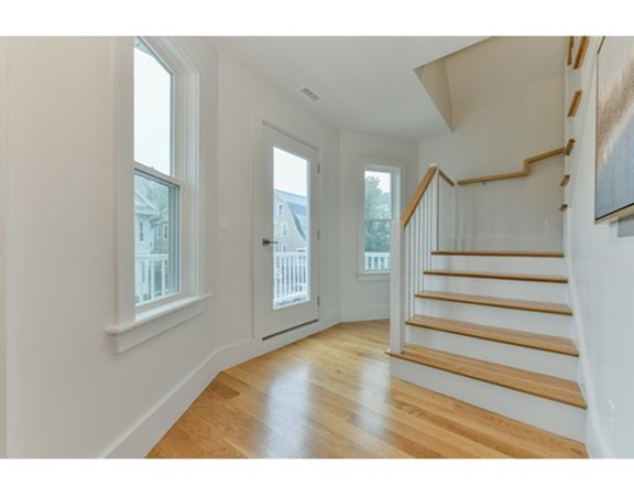 38 Edwin Street, Unit 2 Boston, MA 02124 - Photo 7 of 22 a view of entryway with wooden floor