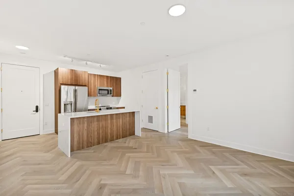 a view of kitchen and wooden floor