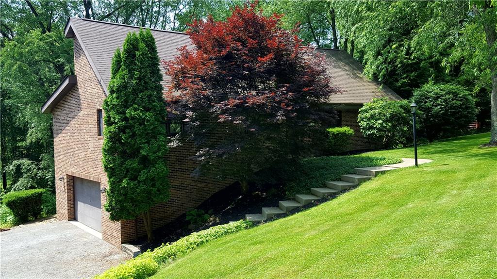 3636 Sandy Hill Road Gibsonia, PA 15044 - Photo 1 of 25 Front of House: All brick ranch home that is situated on over 2 acres. Mature landscaping surrounds the home.