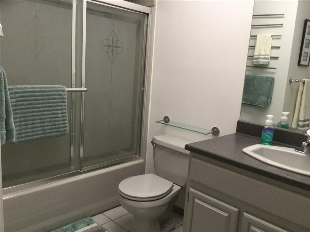 3636 Sandy Hill Road Gibsonia, PA 15044 - Photo 18 of 25 Main Bathroom: Fiberglass shower-tub with decorated glass doors.