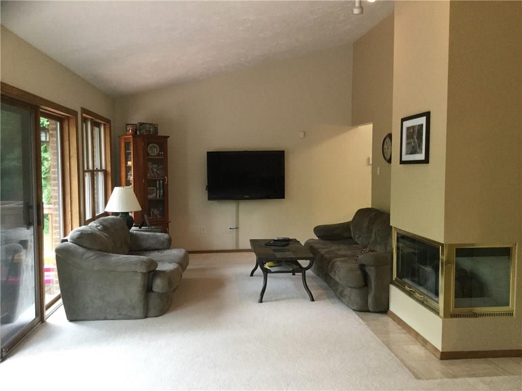 3636 Sandy Hill Road Gibsonia, PA 15044 - Photo 3 of 25 Living Room: 27x12 room gives you so much space for all your furniture. Wall of windows and sliding door leads to your deck.