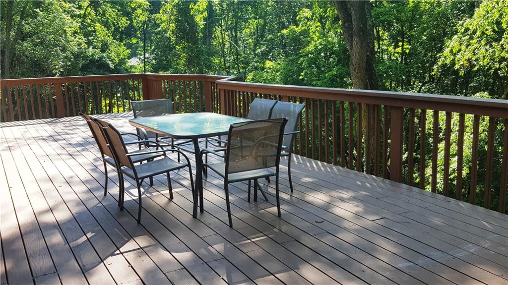 3636 Sandy Hill Road Gibsonia, PA 15044 - Photo 21 of 25 Deck: The deck is the full length of the house that offers for spacious room for your outdoor entertaining or just relaxing and admiring your private back yard.