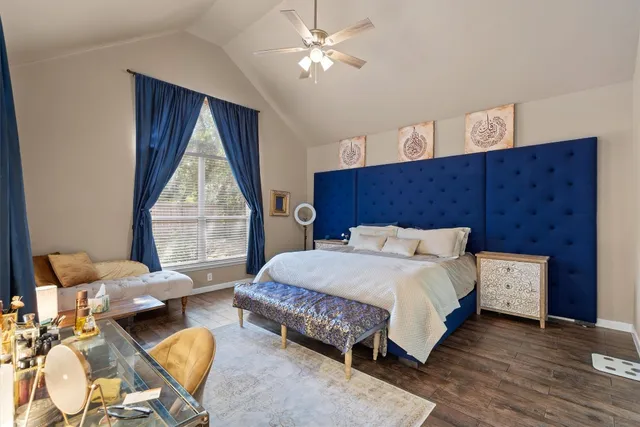 a bedroom with bed and window