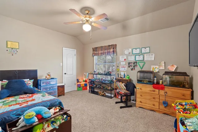 a kids room with toys and a couch