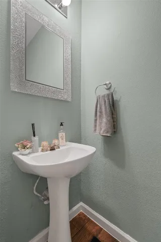 a bathroom with a sink a mirror and vanity