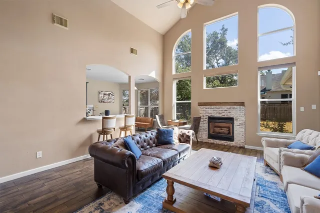 a living room with furniture and a fireplace