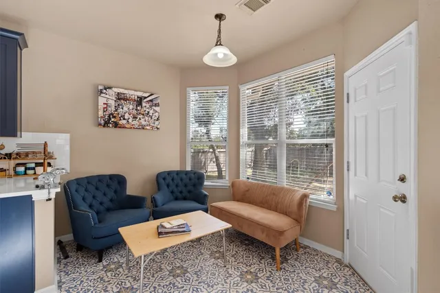 a living room with furniture and a window