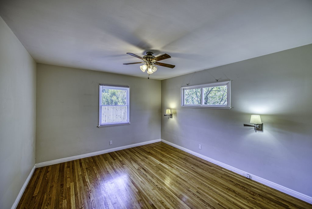 15744 Hart Street Van Nuys, CA 91406 - Photo 16 of 21 wooden floor in an empty room with a window