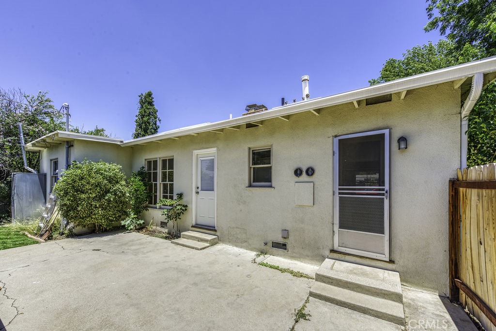 15744 Hart Street Van Nuys, CA 91406 - Photo 18 of 21 a front view of a house with a yard