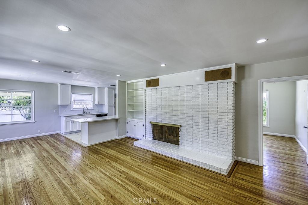 15744 Hart Street Van Nuys, CA 91406 - Photo 3 of 21 a living room with stainless steel appliances kitchen island granite countertop a sink and cabinets