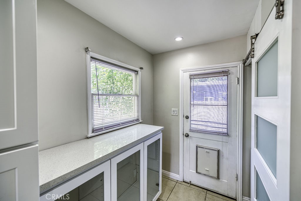 15744 Hart Street Van Nuys, CA 91406 - Photo 8 of 21 a view of a kitchen with wooden floor and electronic appliances