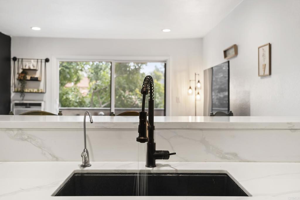6780 Friars Road, Unit 243 San Diego, CA 92108 - Photo 11 of 31 a kitchen with a sink and a large window