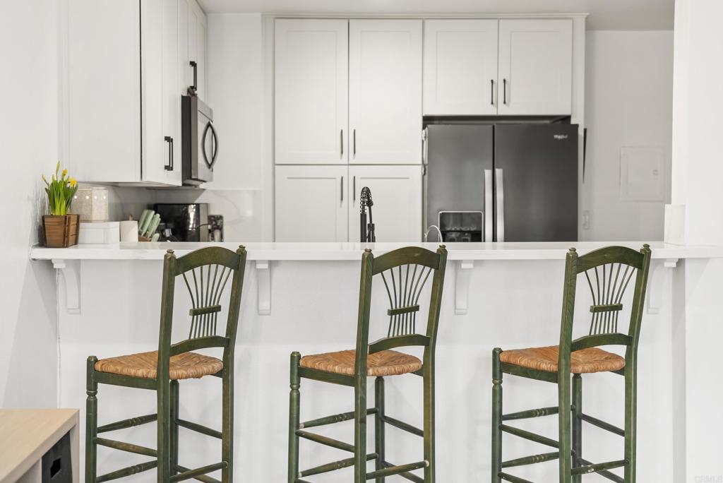 6780 Friars Road, Unit 243 San Diego, CA 92108 - Photo 12 of 31 a dining room with furniture and a window